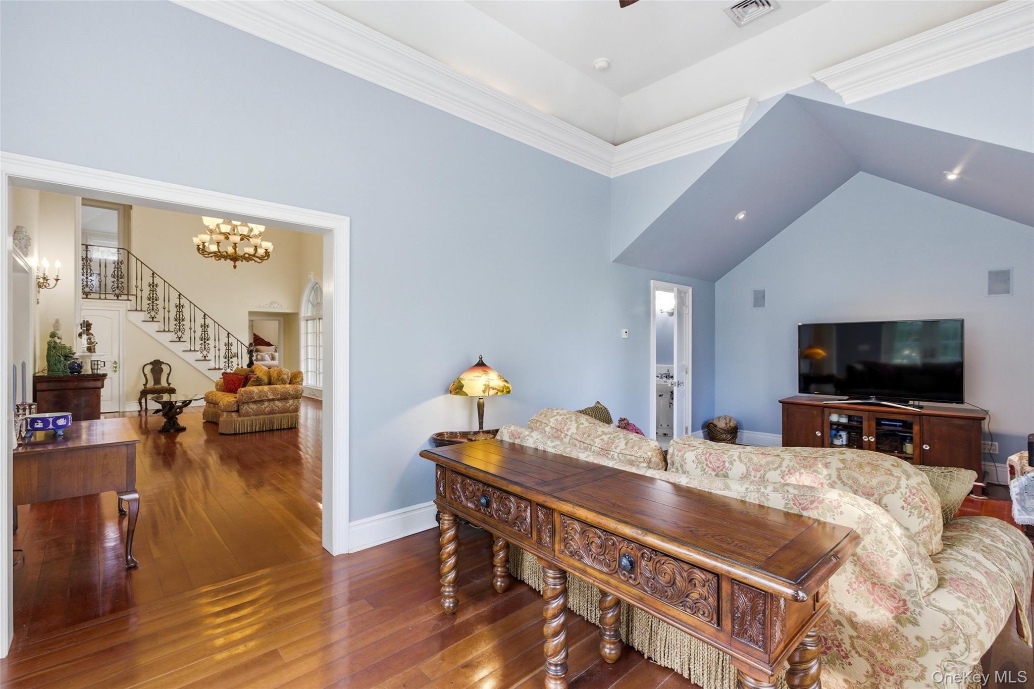 31 West Meadow Road Setauket, NY 11733 - Photo 10 of 28 a living room with furniture and a flat screen tv