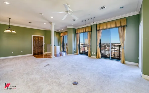 an empty room with closet and mirrors