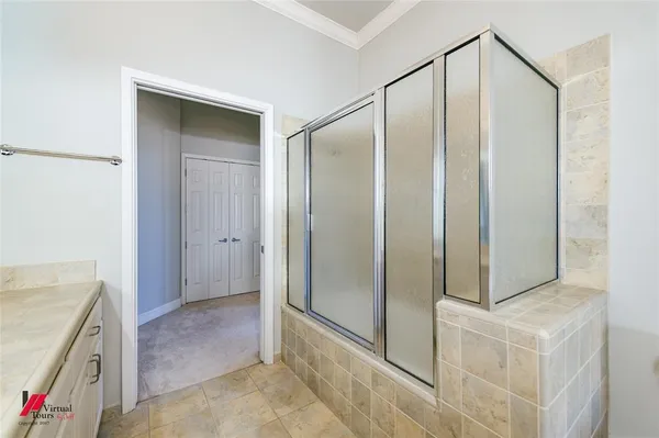 a bathroom with a shower and a sink