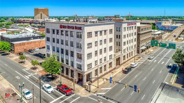 a view of a building with a street