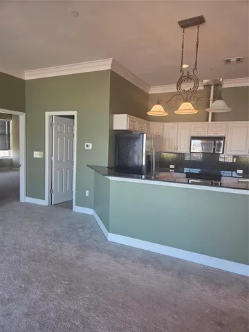 a kitchen with lots of counter space and appliances