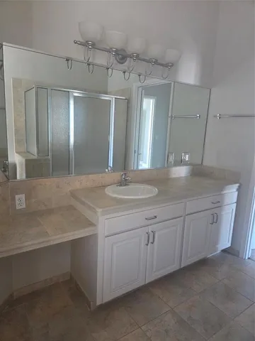 a bathroom with a sink and a mirror