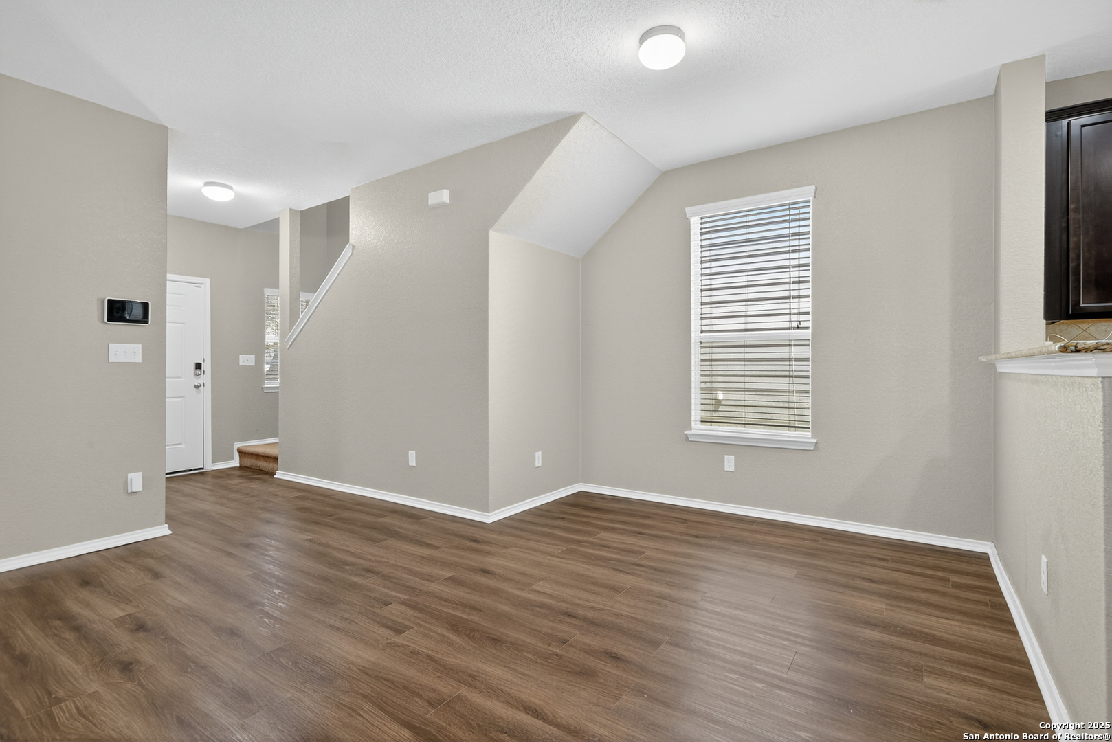 474 Walnut Crest Selma, TX 78154 - Photo 11 of 28 a view of an empty room with wooden floor and a window