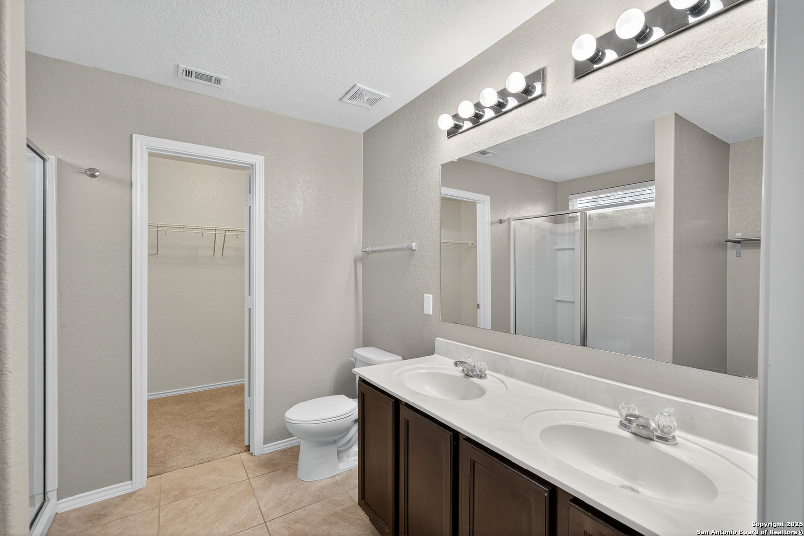 474 Walnut Crest Selma, TX 78154 - Photo 16 of 28 a bathroom with a sink a toilet and a mirror