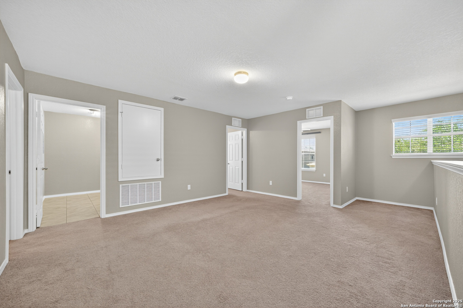 474 Walnut Crest Selma, TX 78154 - Photo 22 of 28 a view of an empty room with windows and closet