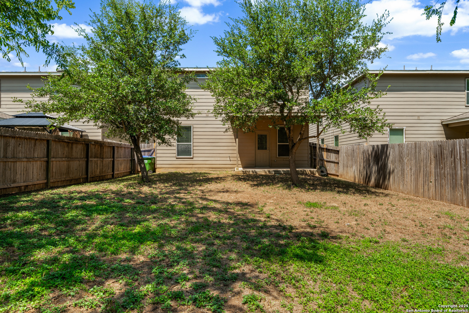 474 Walnut Crest Selma, TX 78154 - Photo 28 of 28 a backyard of a house with plants and tree