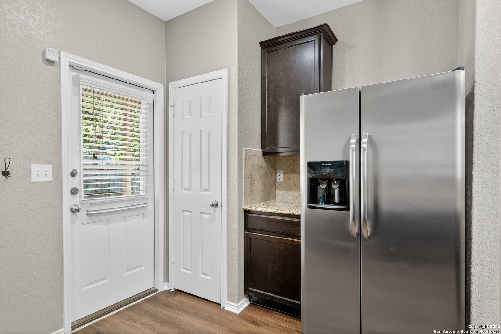 474 Walnut Crest Selma, TX 78154 - Photo 9 of 28 a metallic refrigerator freezer sitting in a kitchen