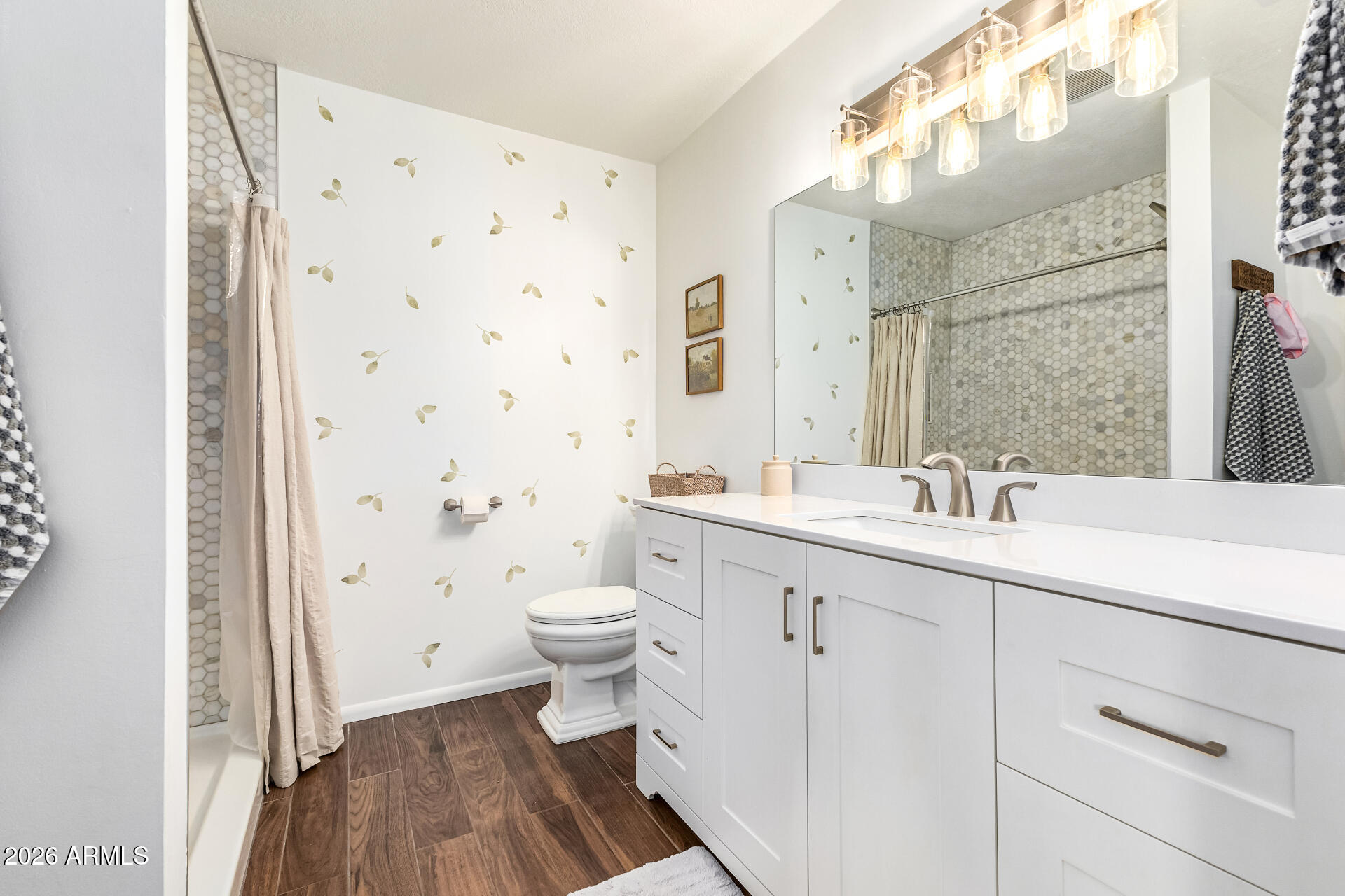 21 South Neely Street Gilbert, AZ 85233 - Photo 15 of 28 a bathroom with a sink a toilet a shower and a mirror