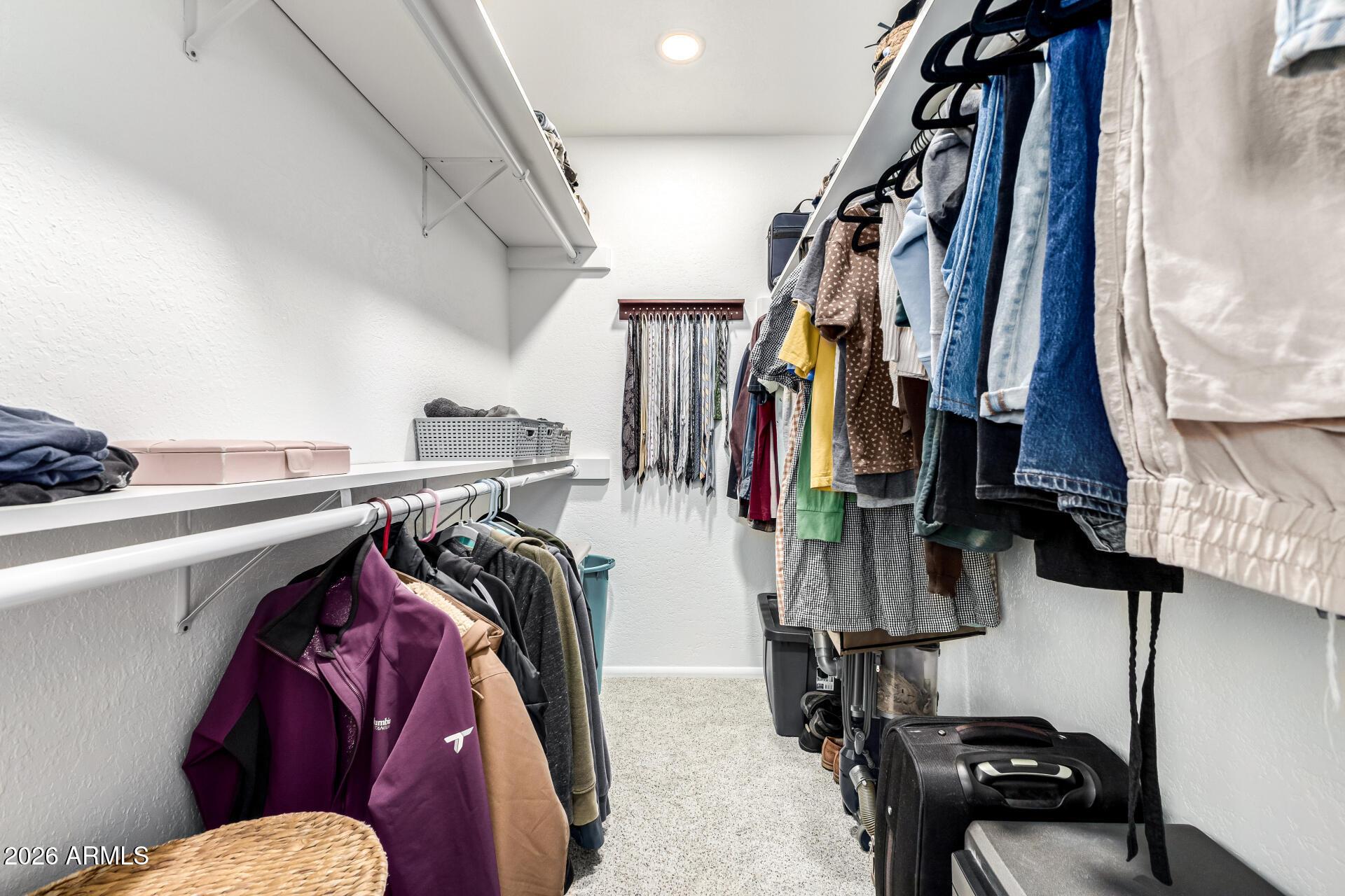 21 South Neely Street Gilbert, AZ 85233 - Photo 16 of 28 a view of walk in closet with clothes and shoes