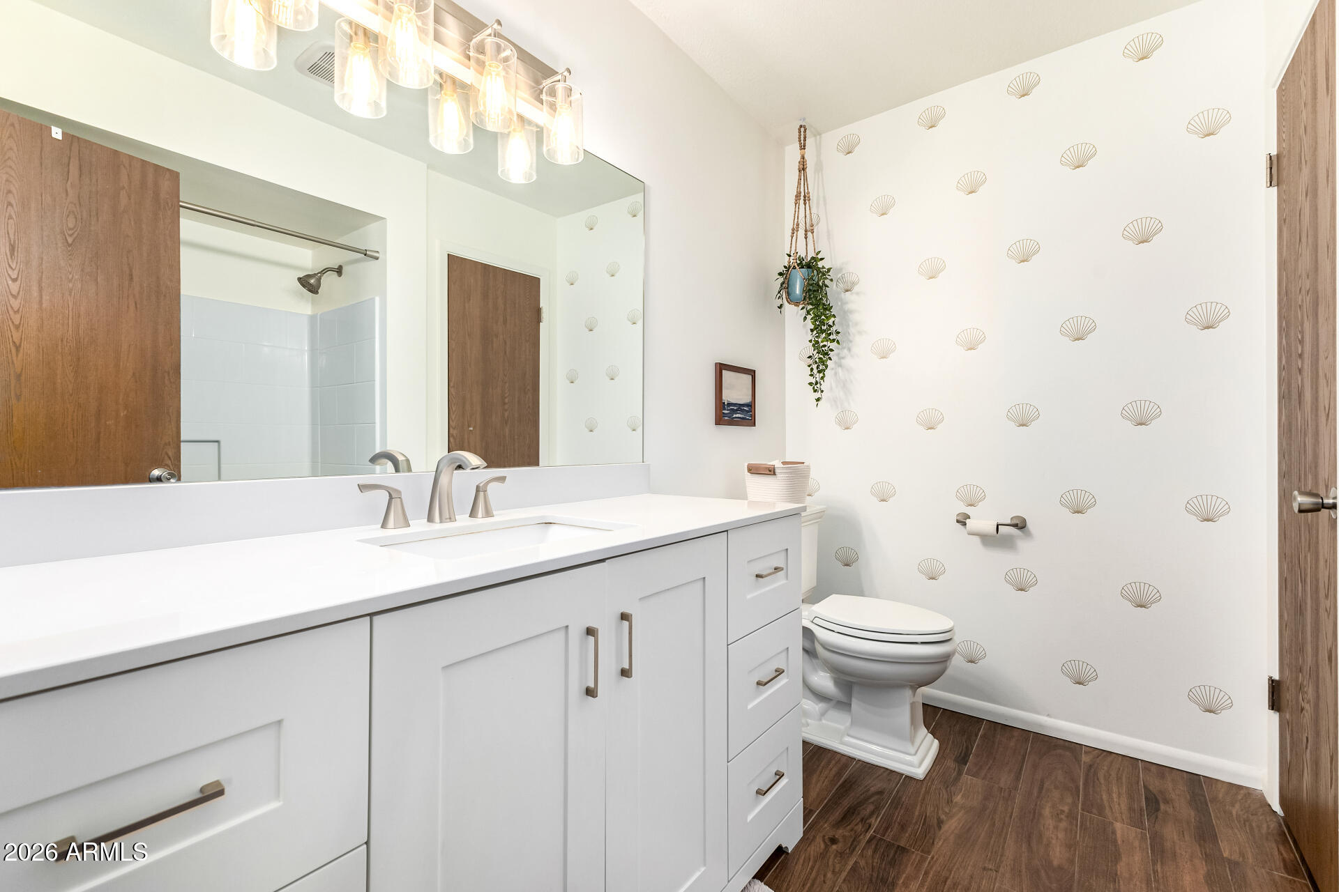 21 South Neely Street Gilbert, AZ 85233 - Photo 21 of 28 a bathroom with a sink a toilet and shower