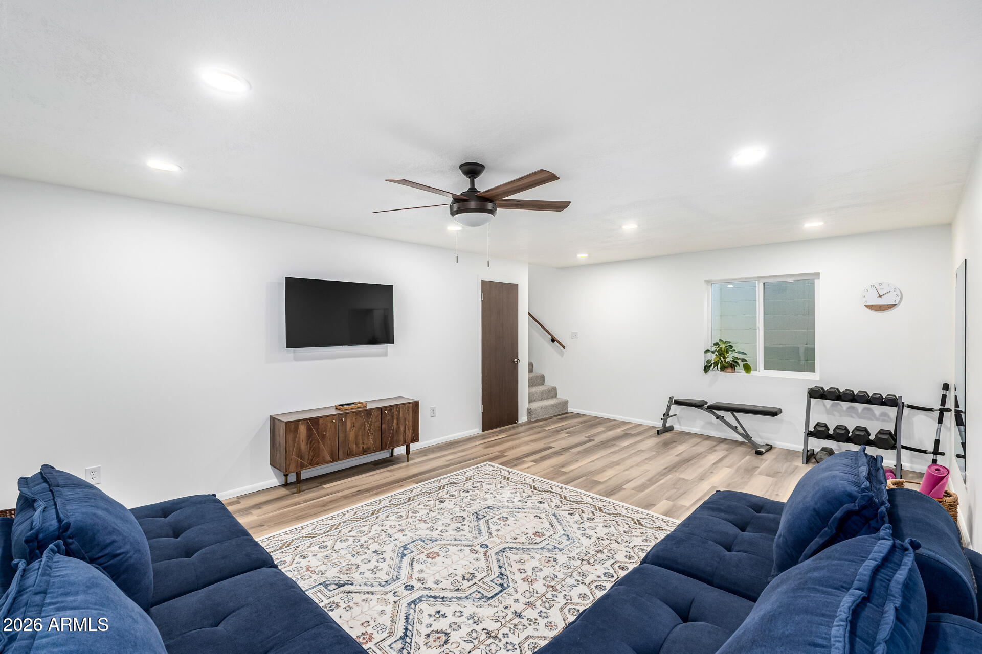 21 South Neely Street Gilbert, AZ 85233 - Photo 25 of 28 a living room with furniture and a flat screen tv