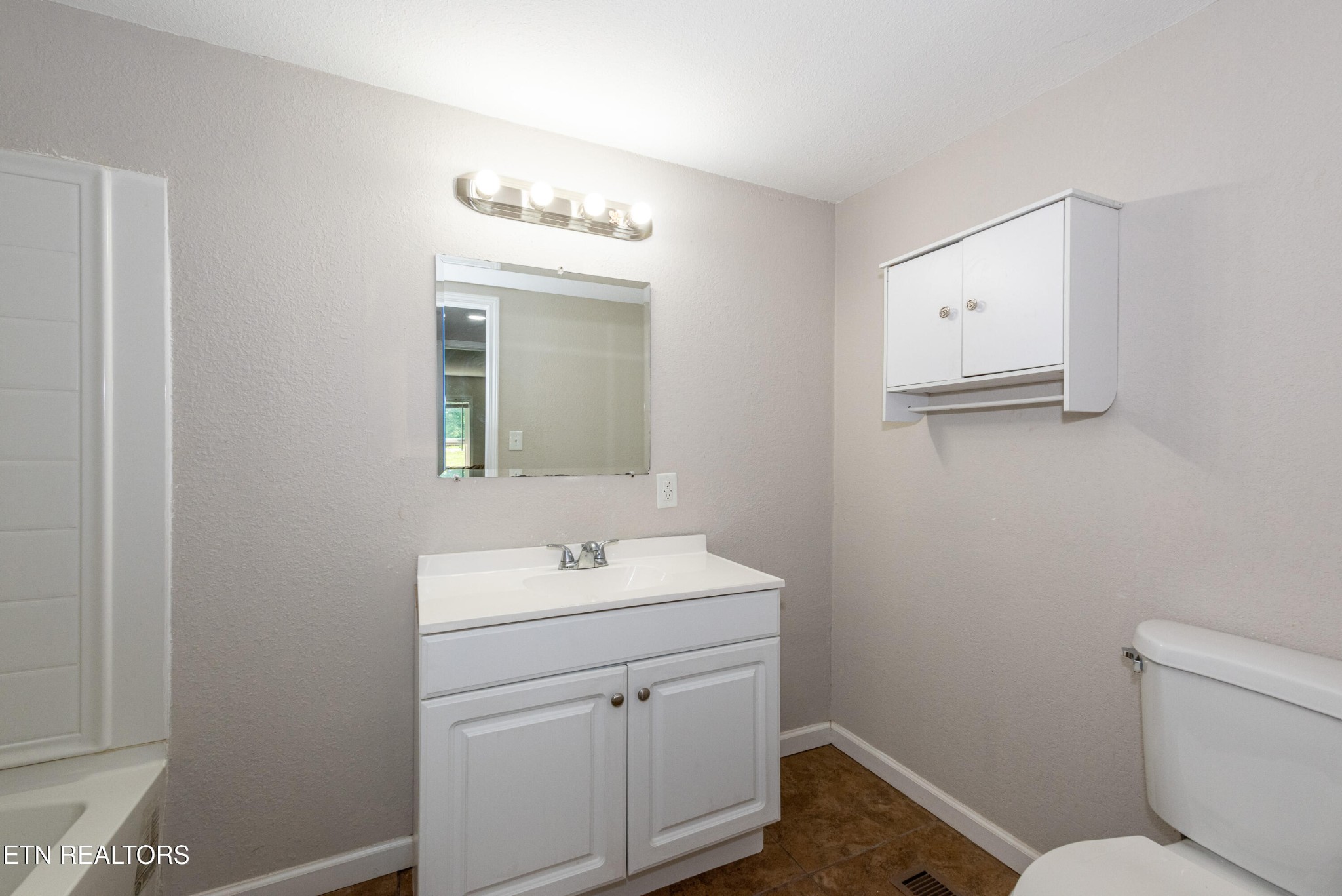 460 Lee Shirley Road Greenback, TN 37742 - Photo 18 of 29 a bathroom with a toilet sink and mirror