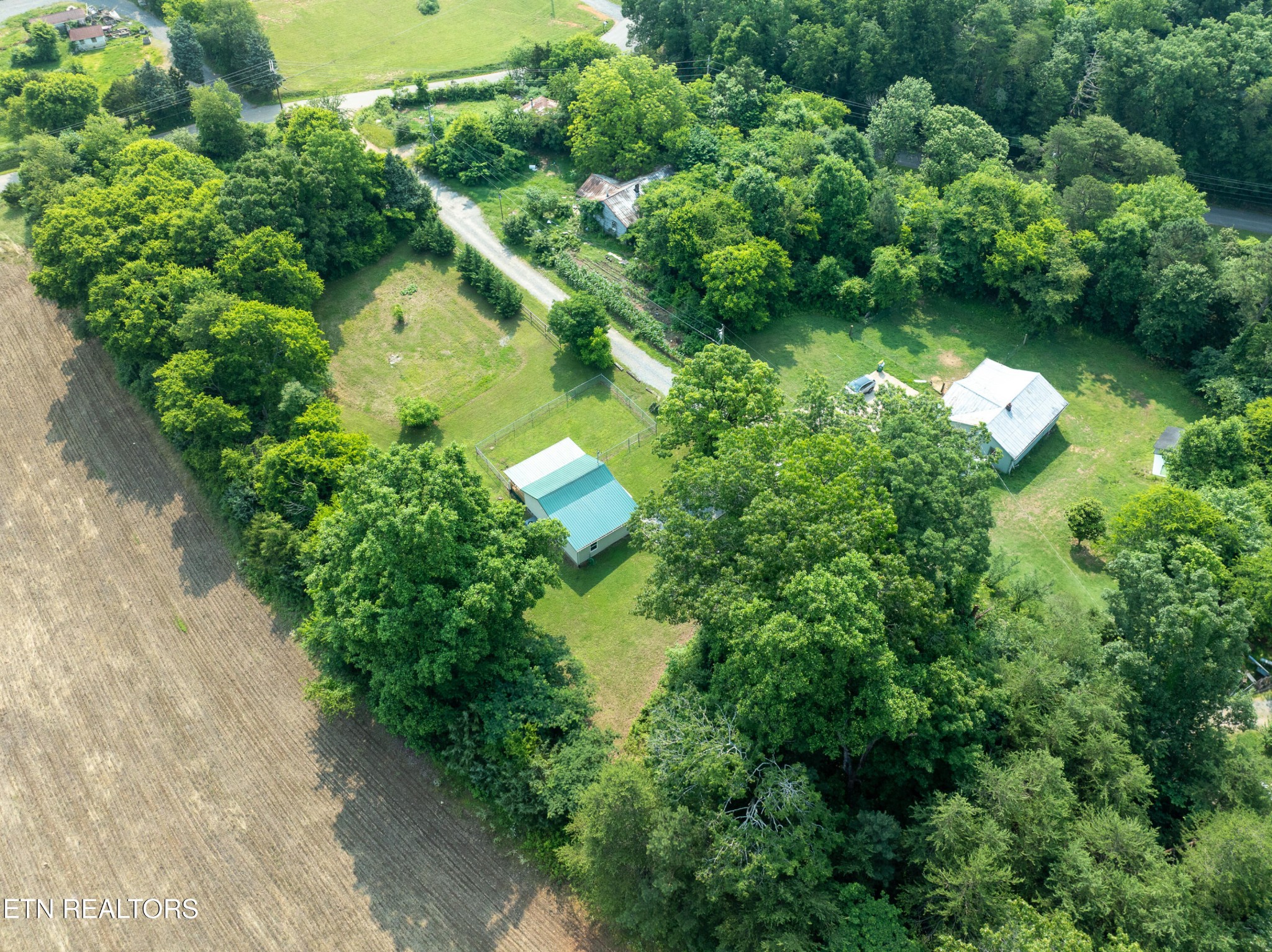 460 Lee Shirley Road Greenback, TN 37742 - Photo 28 of 29 an aerial view of residential house with outdoor space and trees all around