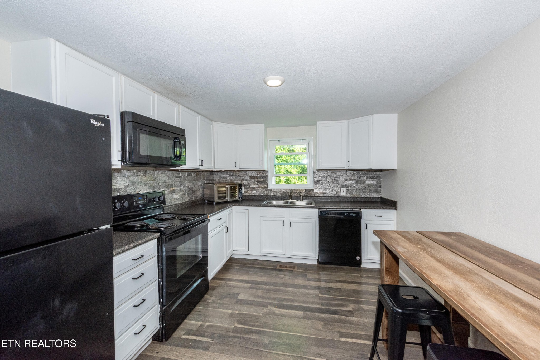 460 Lee Shirley Road Greenback, TN 37742 - Photo 6 of 29 a kitchen with a stove a sink and a microwave