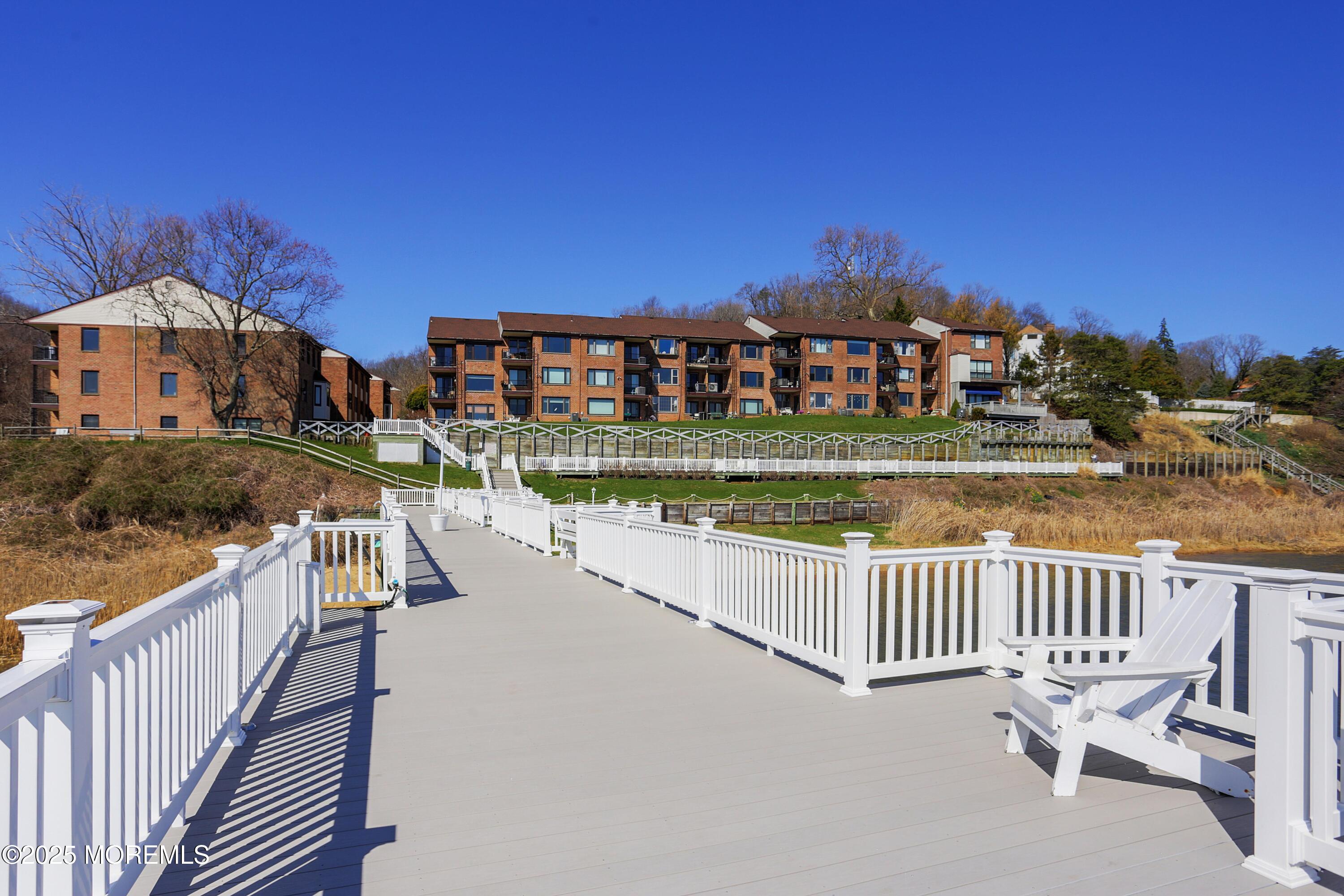 200 Portland Road, Unit C2 Highlands, NJ 07732 - Photo 16 of 22 a view of a house with a yard and deck