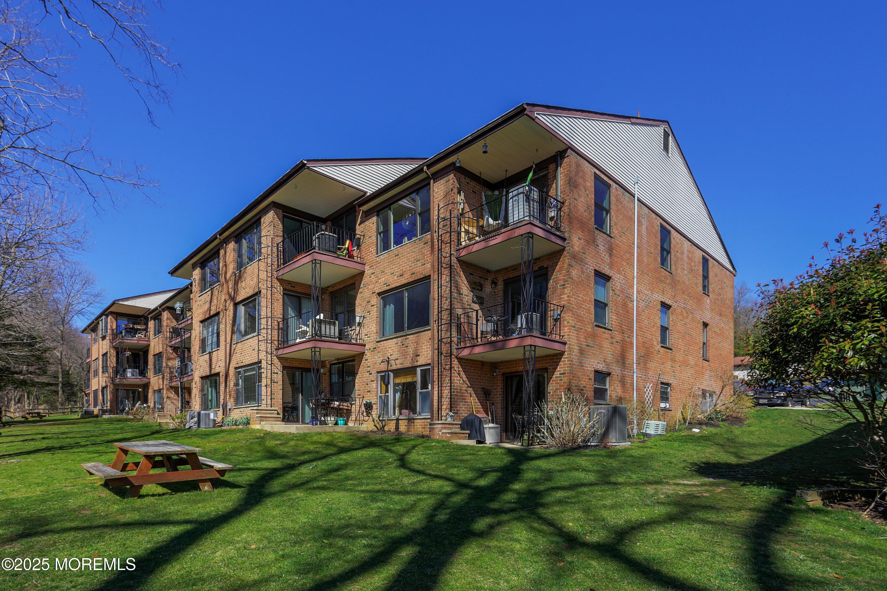 200 Portland Road, Unit C2 Highlands, NJ 07732 - Photo 20 of 22 a view of a building with a yard