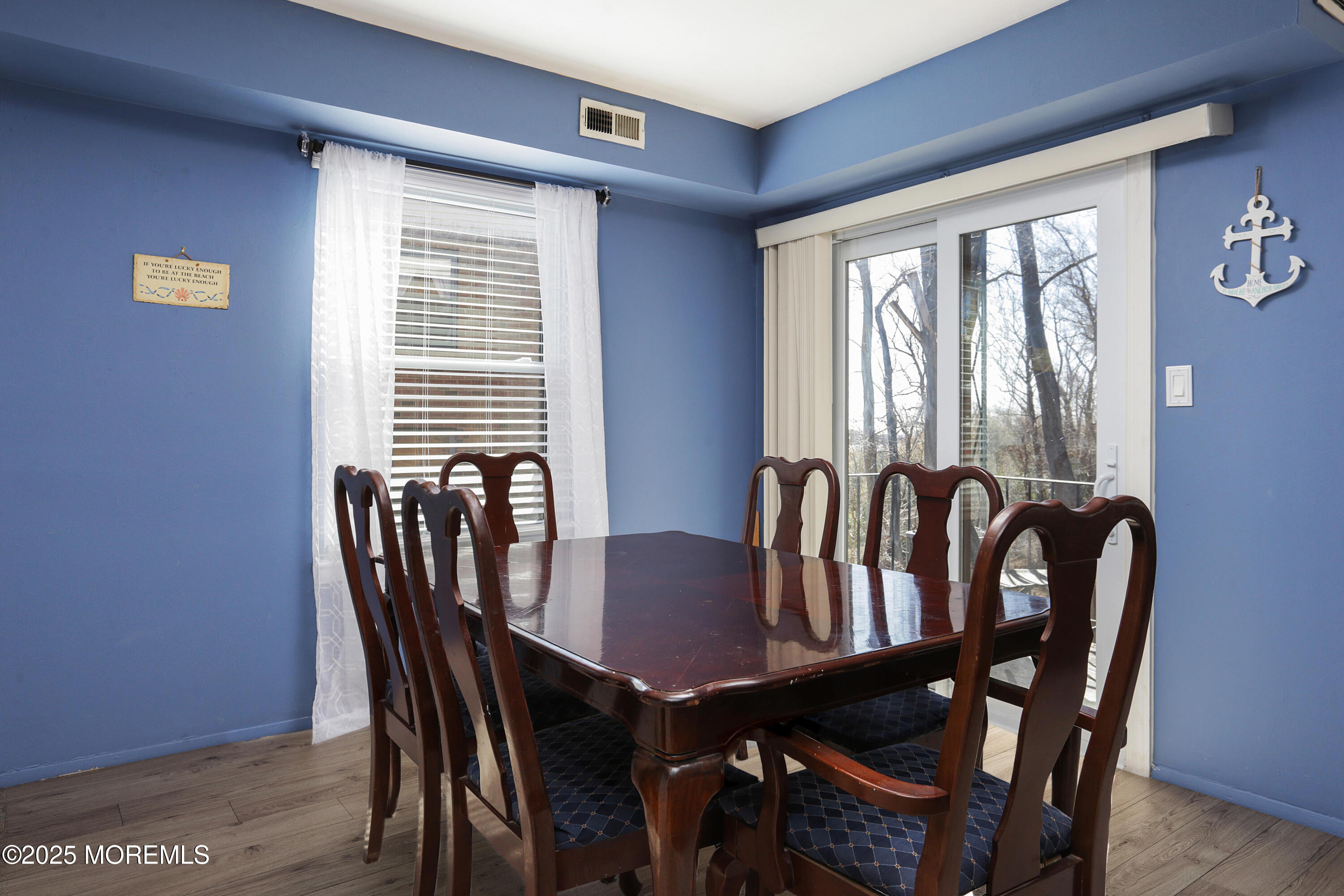200 Portland Road, Unit C2 Highlands, NJ 07732 - Photo 6 of 22 a view of a a dining room with furniture window and wooden floor