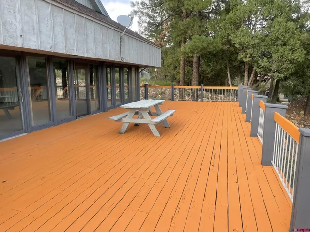 a view of swimming pool with wooden deck and floor