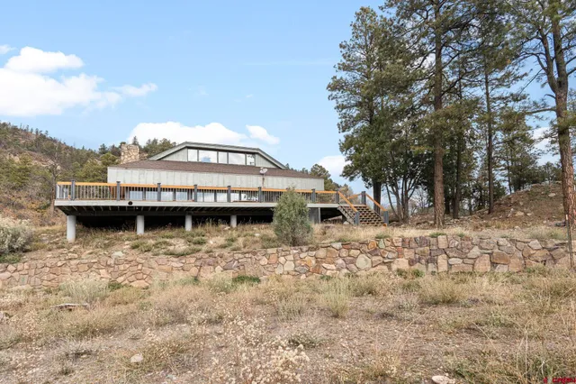 a view of a house with a yard balcony