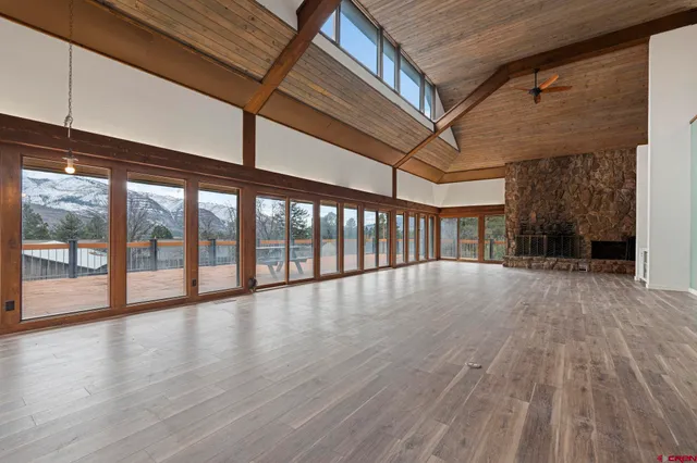a view of an entryway with wooden floor