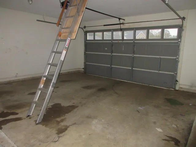 a view of an empty room with a staircase