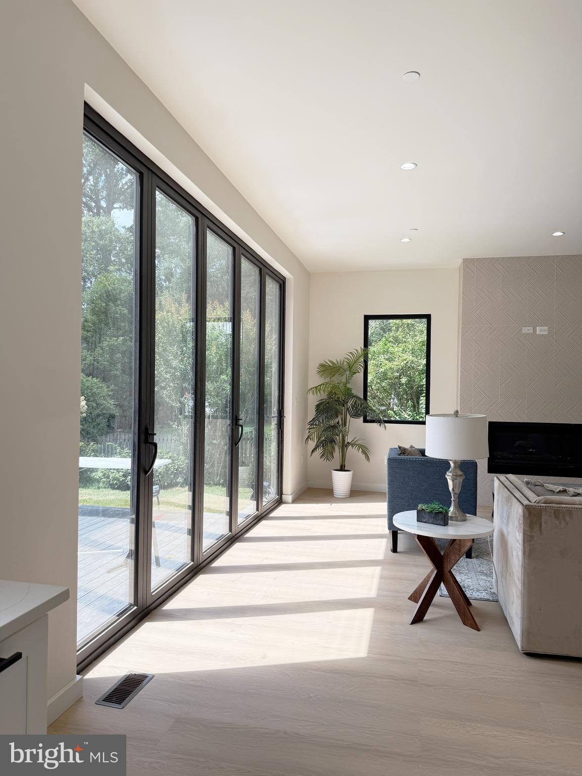 8908 Mohawk Lane Bethesda, MD 20817 - Photo 11 of 46 Family room with bi folding door to patio