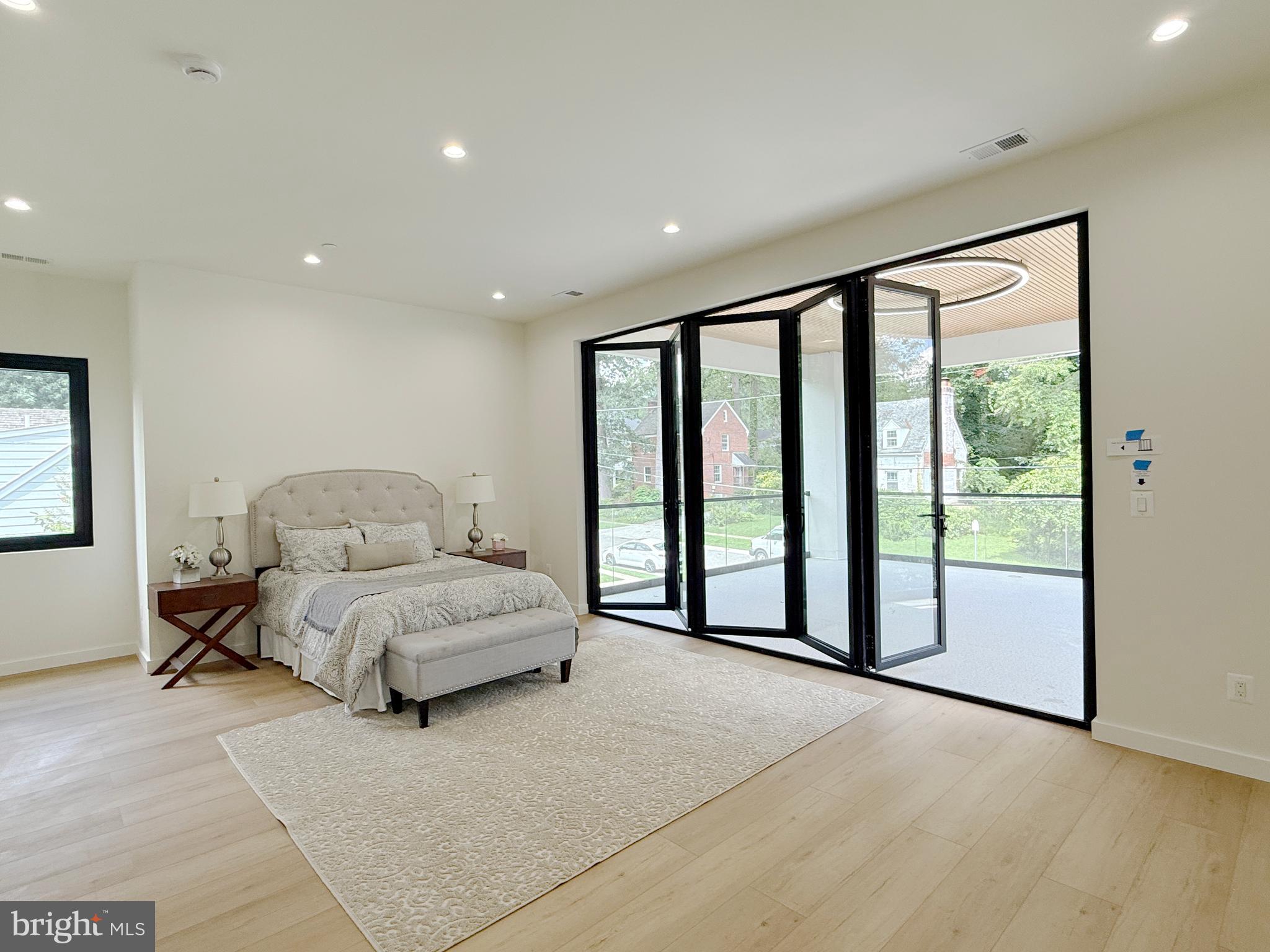 8908 Mohawk Lane Bethesda, MD 20817 - Photo 20 of 46 Main bedroom with Bi-folding door to balcony