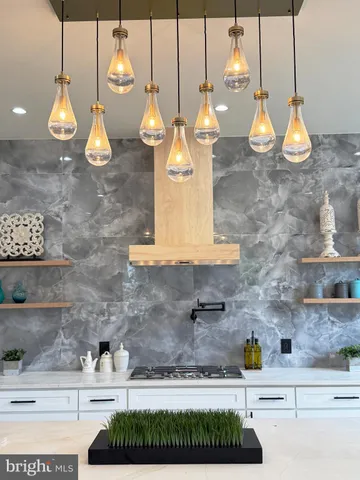a kitchen with a sink and kitchen island