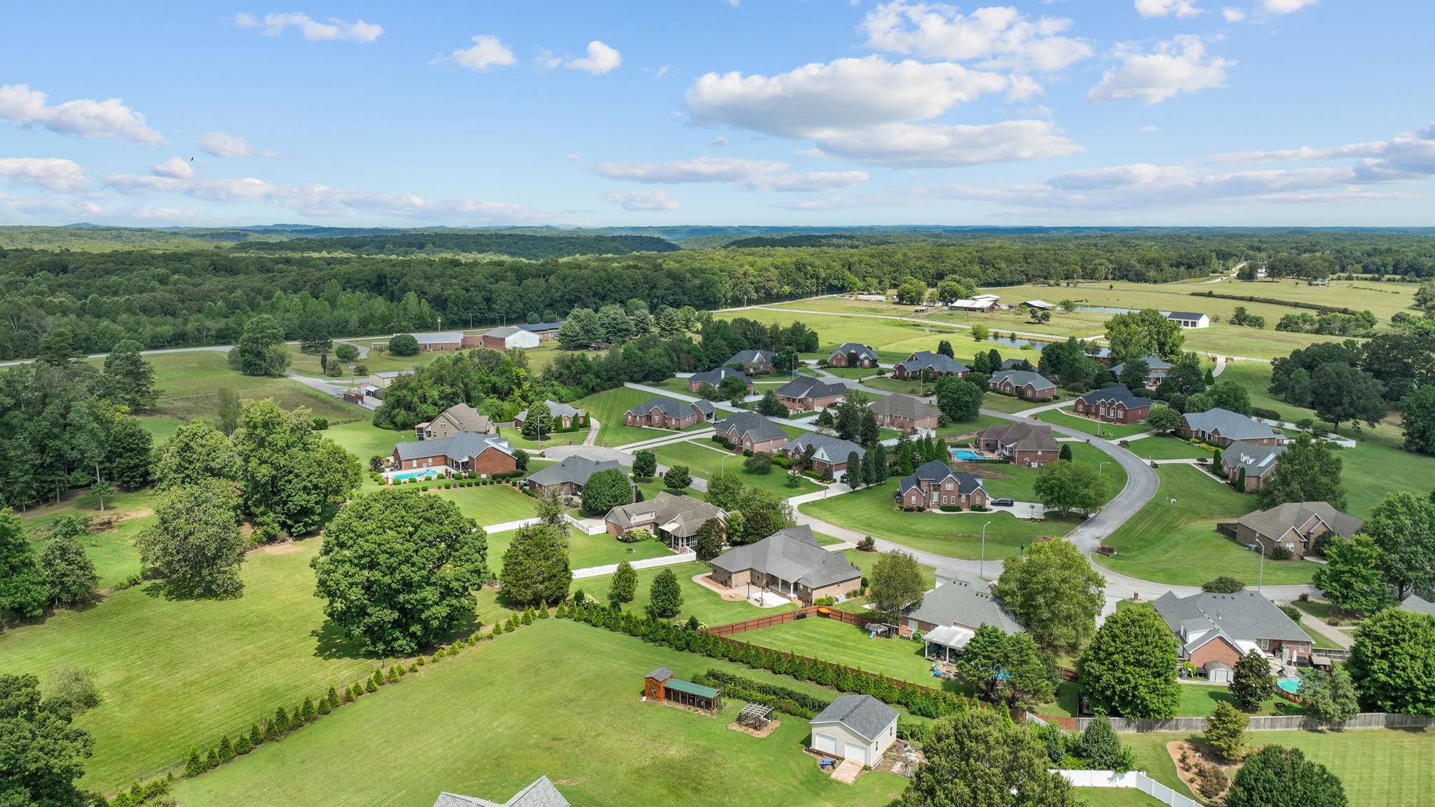 201 Hunters Ridge Drive Tullahoma, TN 37388 - Photo 5 of 45 an aerial view of residential houses with outdoor space and trees