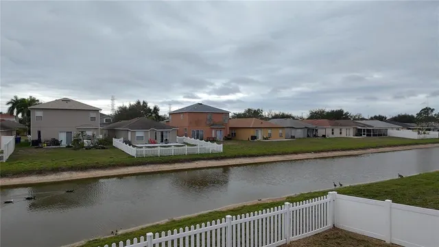 aerial view of a house with a lake view