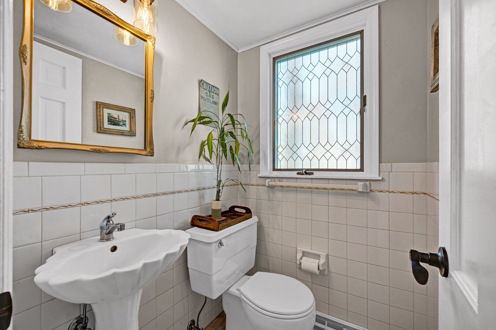 903 Crestline Drive Normal, IL 61761 - Photo 15 of 35 a bathroom with a toilet sink and mirror
