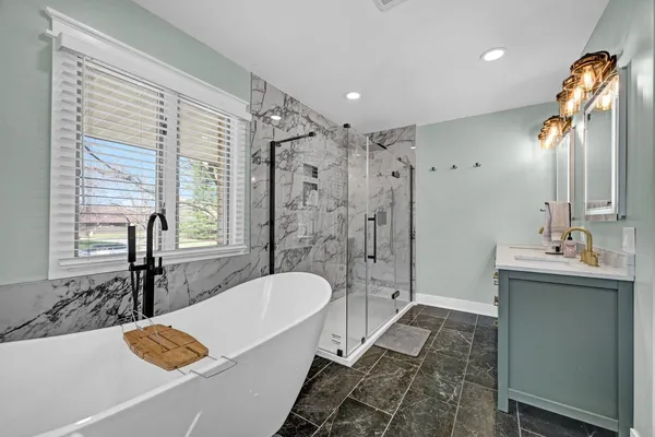 a bathroom with a double vanity sink mirror and double