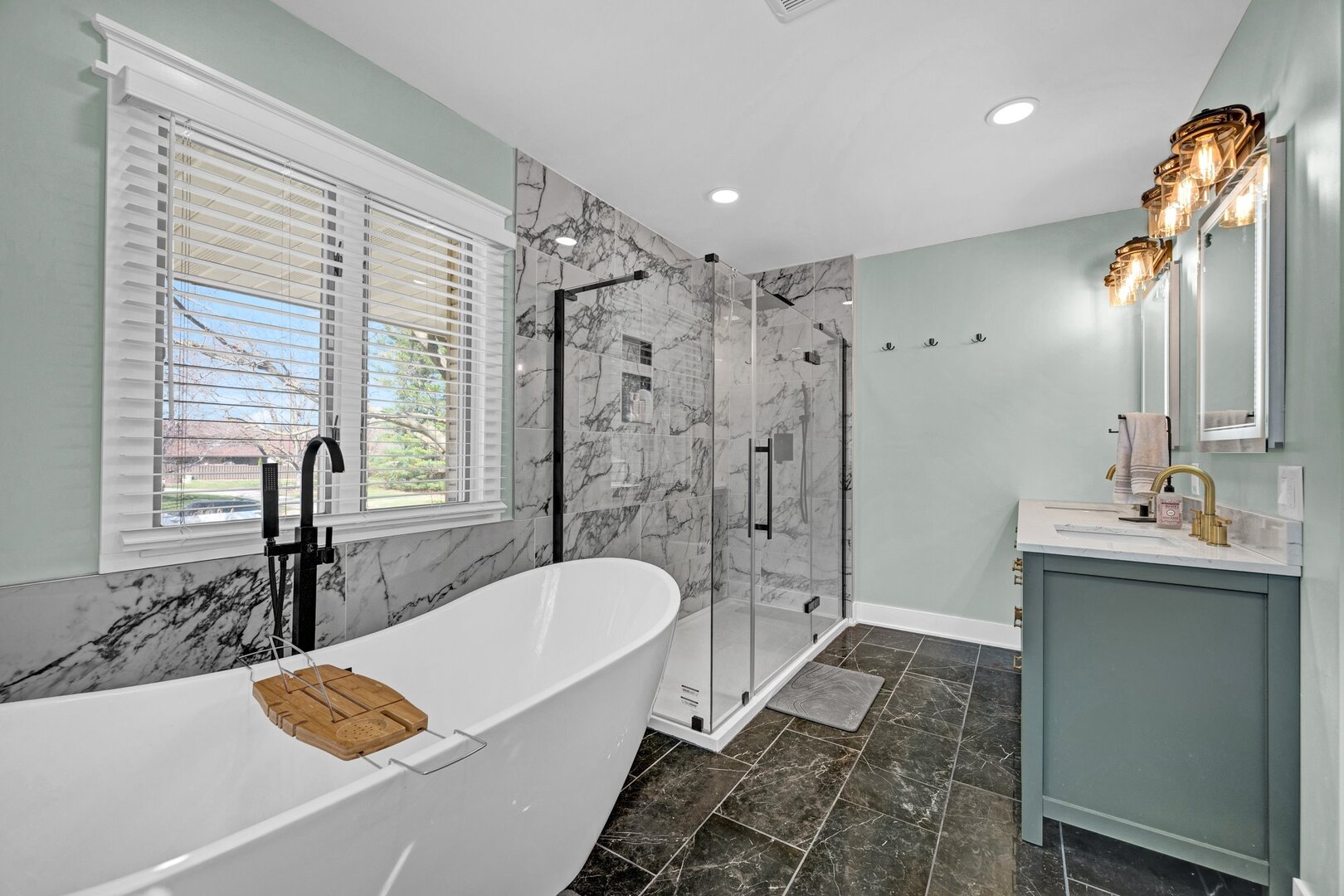 903 Crestline Drive Normal, IL 61761 - Photo 20 of 35 a bathroom with a tub sink and mirror