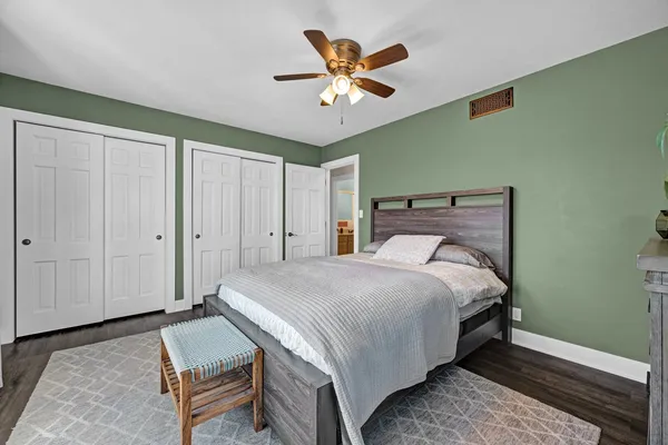 a bathroom with a double vanity sink a mirror and a bathtub