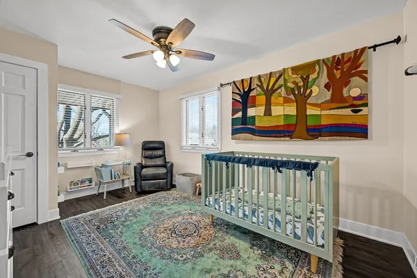a living room with furniture a pool table and a fireplace