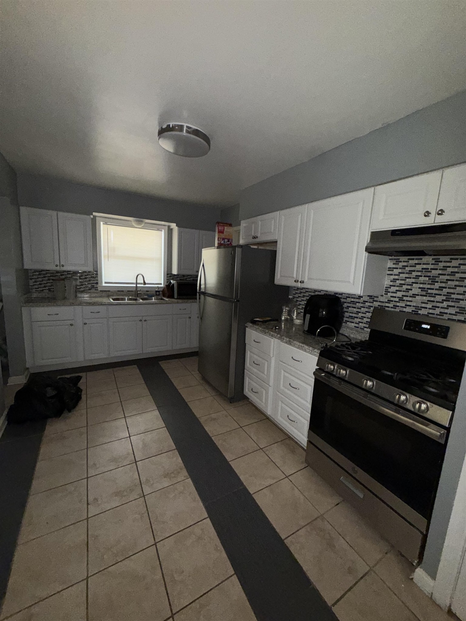 179 Ivan Road Memphis, TN 38109 - Photo 13 of 22 a kitchen with a cabinets and steel appliances