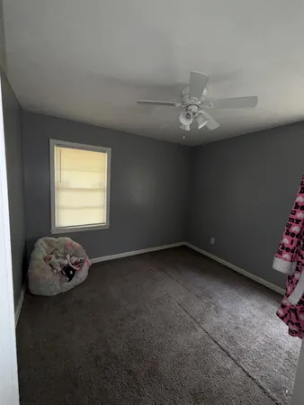 a view of a room that has a window in it
