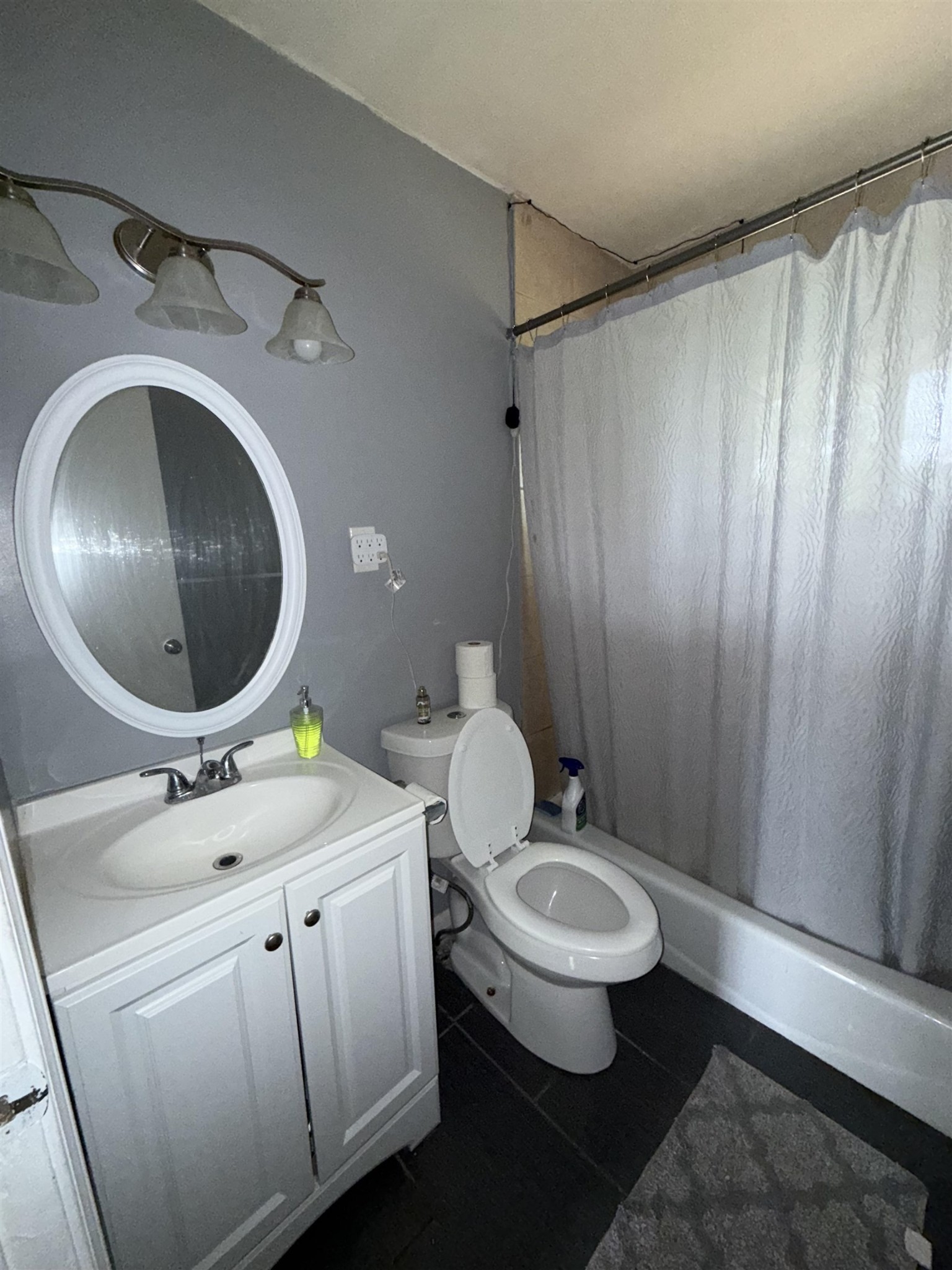 179 Ivan Road Memphis, TN 38109 - Photo 22 of 22 a bathroom with a granite countertop toilet sink and mirror