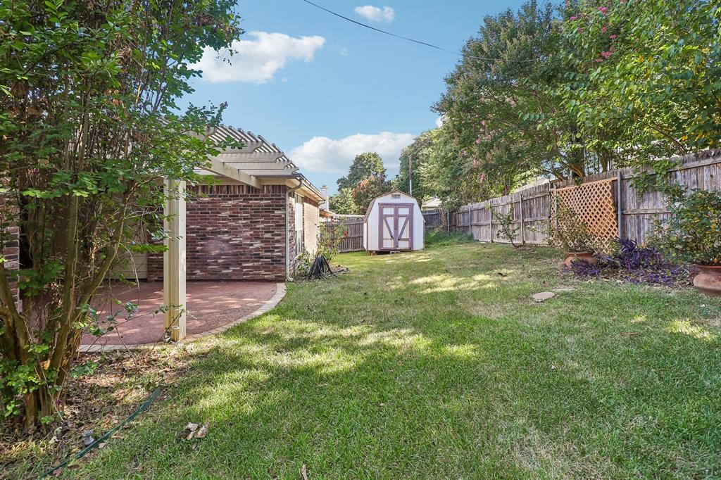 5609 Saddleback Road Arlington, TX 76017 - Photo 22 of 23 a view of a house with a yard and sitting area