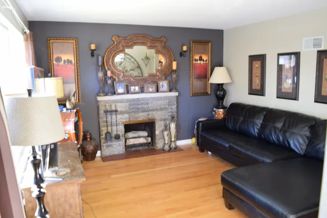 a living room with furniture and a fireplace