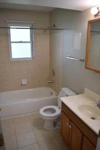 a bathroom with a sink toilet and bathtub