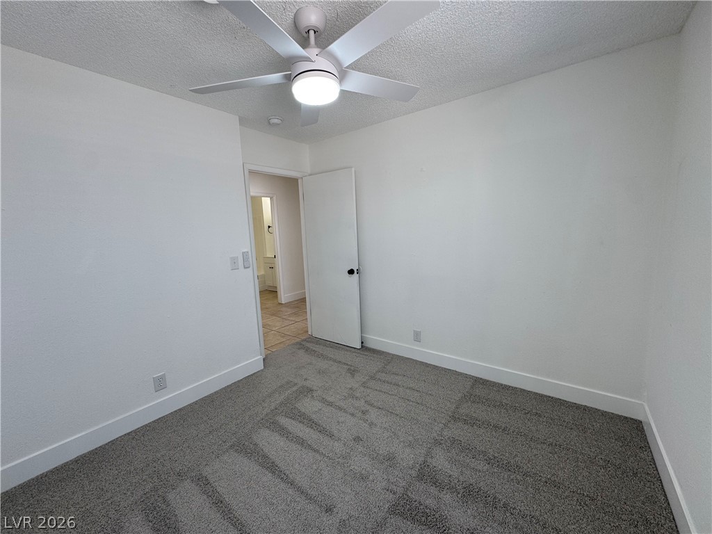 4048 Maple Hill Road Las Vegas, NV 89115 - Photo 30 of 40 3rd bedroom with new ceiling fan, carpet, and window blinds.