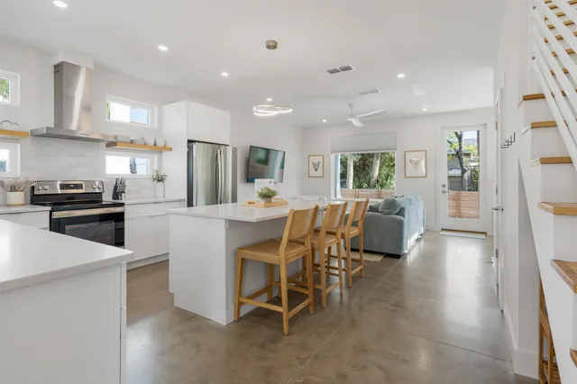 a kitchen with a table and chairs