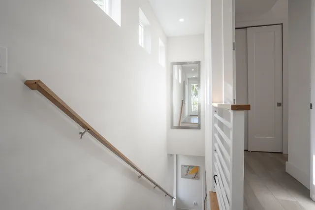 a view of an entryway with wooden floor