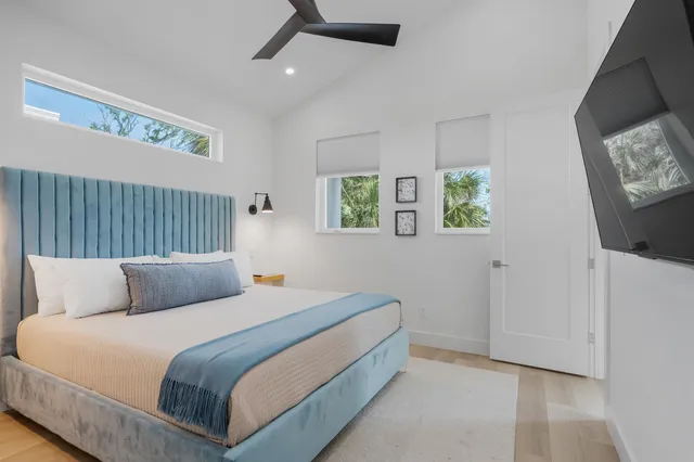 a bedroom with bed and window