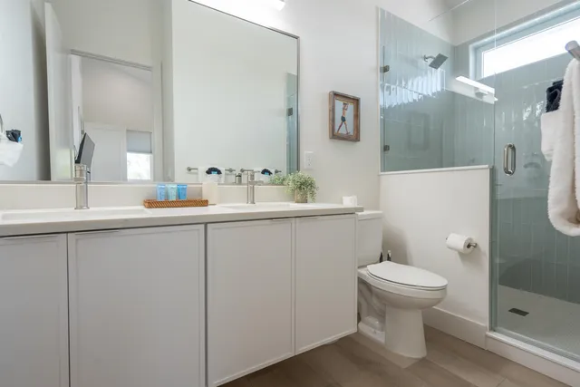 a bathroom with a sink toilet and shower