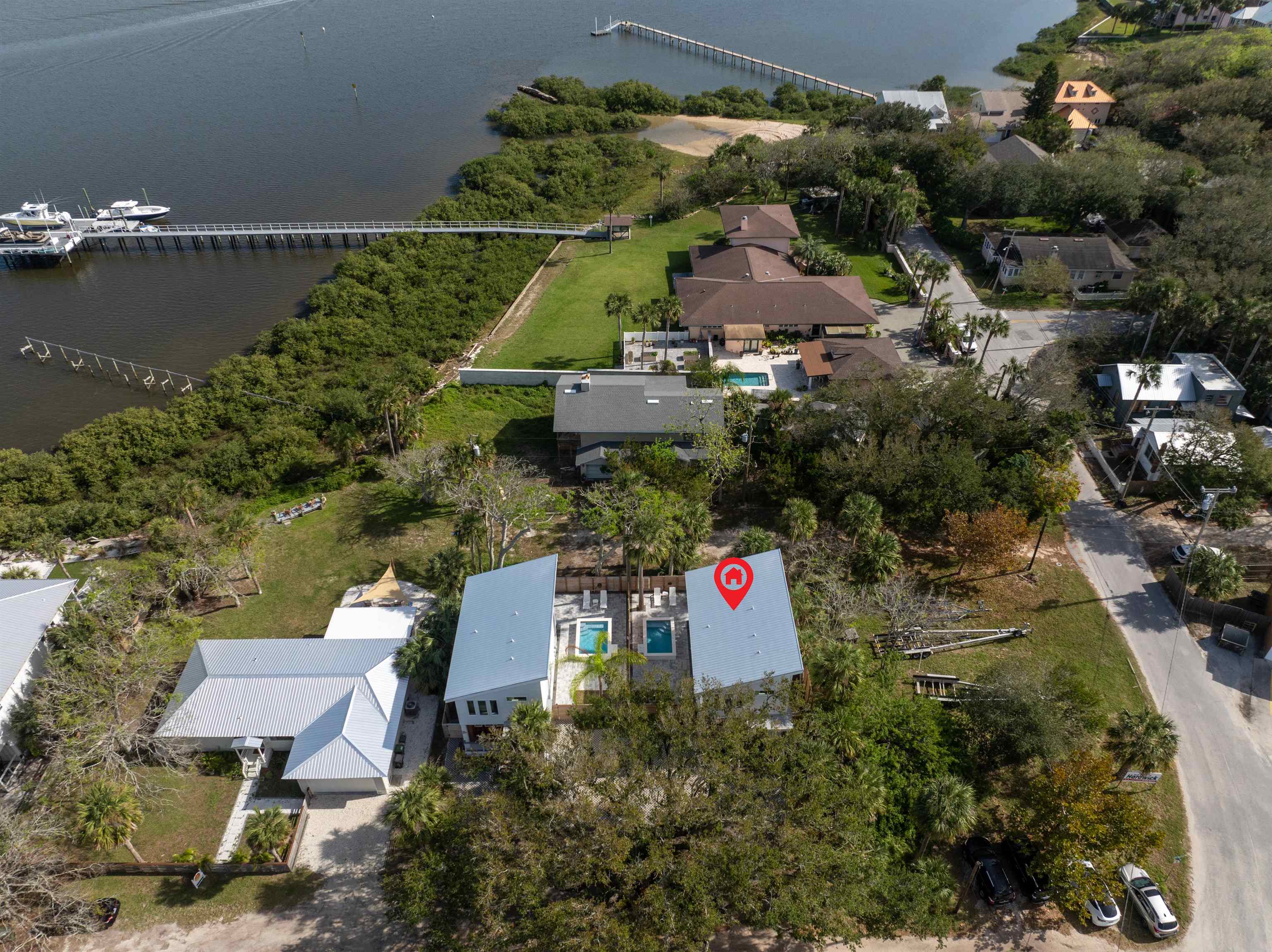 2 Sanchez Cove St. Augustine, FL 32080 - Photo 34 of 45 an aerial view of a house with a yard and lake view