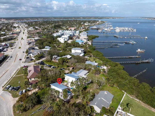 an aerial view of residential houses with outdoor space