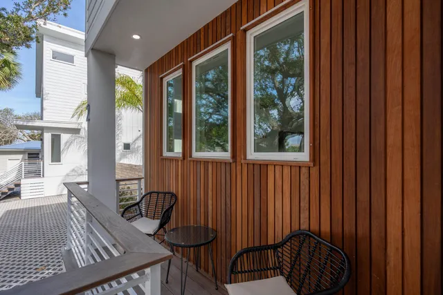 a view of a porch with furniture and yard