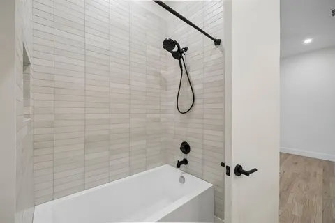 a close view of a utility room with dryer and washer